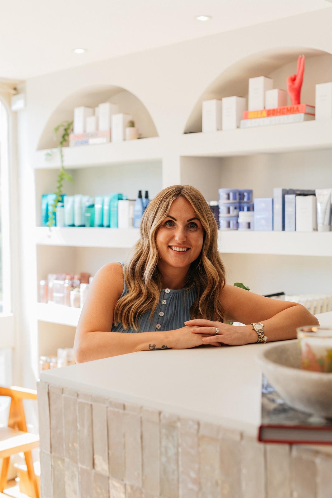 Ivy Grace reception area with beauty products in background