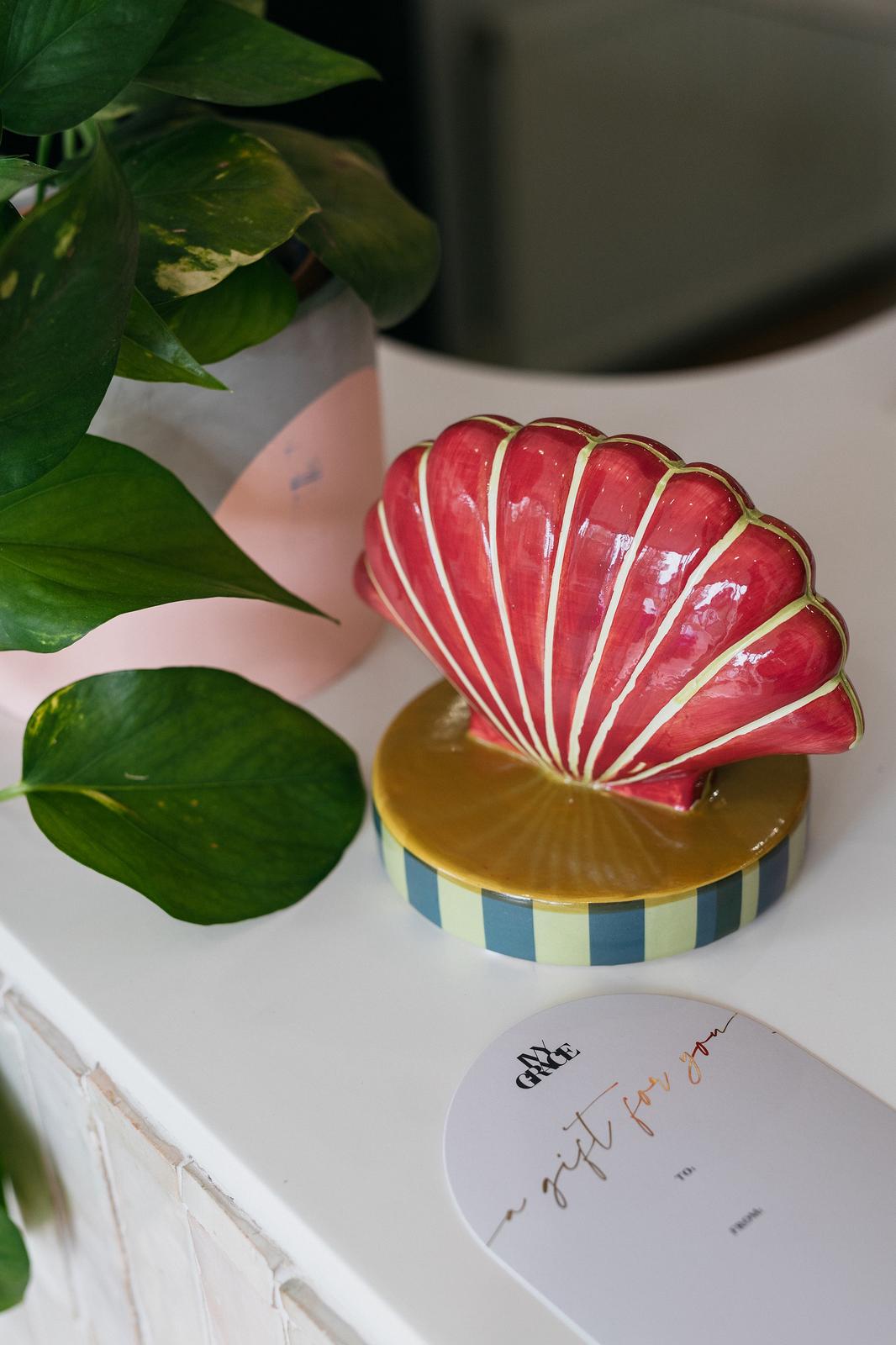 Ivy Grace salon reception with shell ornament on front desk